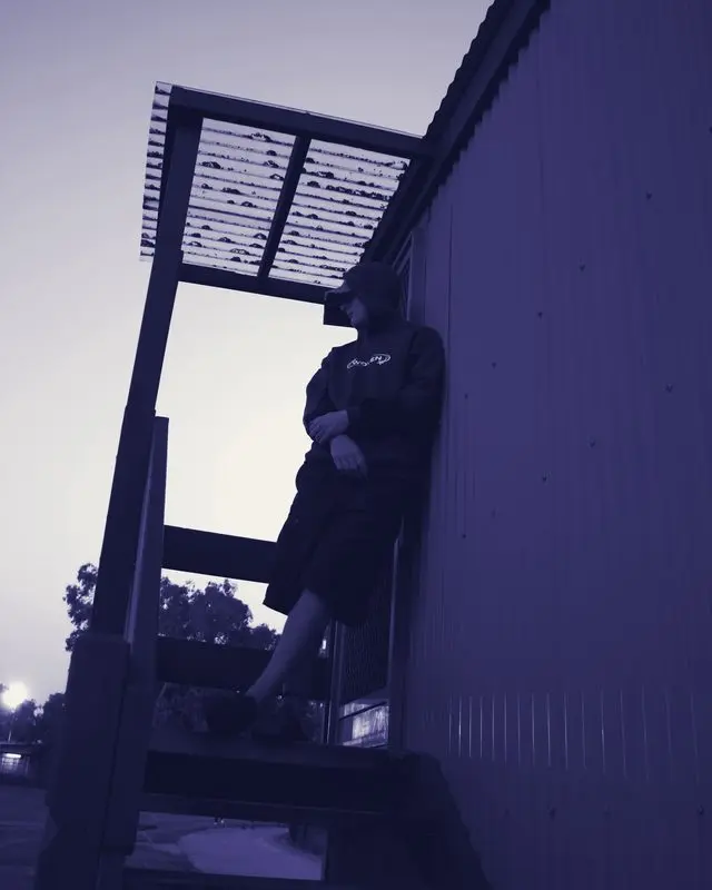 Woven hoodie, rooftop shot looking skyward