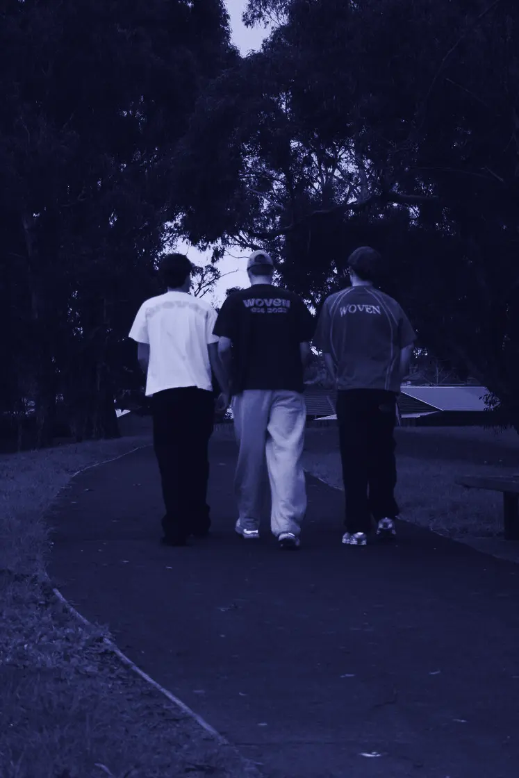 Three mates in Woven tees on a neighbourhood walk
